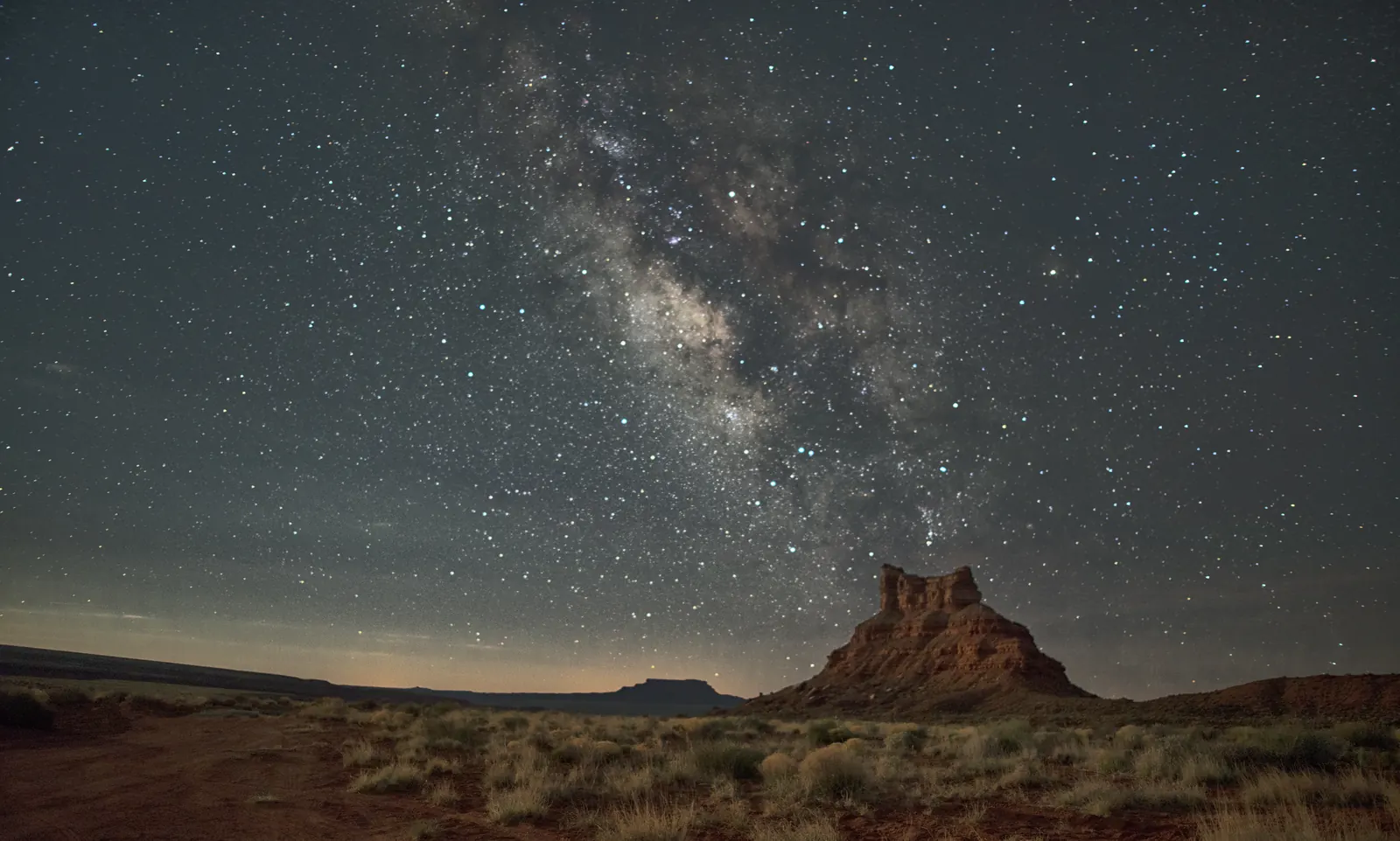 The Milky Way over a sandstone butte in the Valley of the Gods, Utah